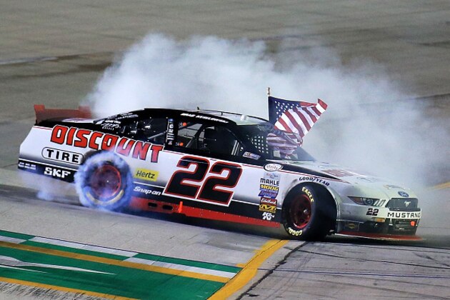 SPARTA, KY - JULY 10:  Brad Keselowski, driver of the #22 Discount Tire Ford, celebrates with a burnout after winning the NASCAR XFINITY Series Kentucky 300 at Kentucky Speedway on July 10, 2015 in Sparta, Kentucky.  (Photo by Daniel Shirey/Getty Images)