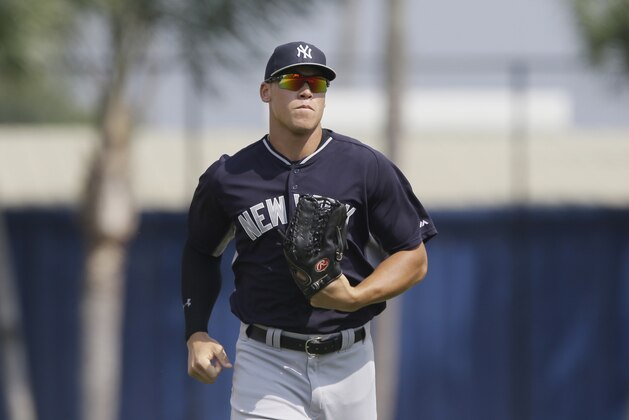 New York Yankees right fielder Aaron Judge runs to the dugout during the seventh inning of a spring training exhibition baseball game against the Detroit Tigers in Lakeland, Fla., Friday, March 20, 2015. (AP Photo/Carlos Osorio)