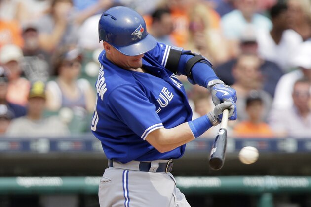 Toronto Blue Jays' Josh Donaldson singles during the fifth inning to drive in Devon Travis against the Detroit Tigers during a baseball game Sunday, July 5, 2015, in Detroit. (AP Photo/Duane Burleson)