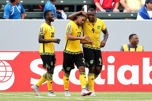 LOS ANGELES, CA - JULY 08:  Jermaine Taylor #22 of Jamaica celebrates with Westley Morgan #4 and Kemar Lawrence #20 after his first half goal against Costa Rica in their CONCACAF Gold Cup Group B match at StubHub Center on July 8, 2015 in Los Angeles, California.  (Photo by Stephen Dunn/Getty Images)