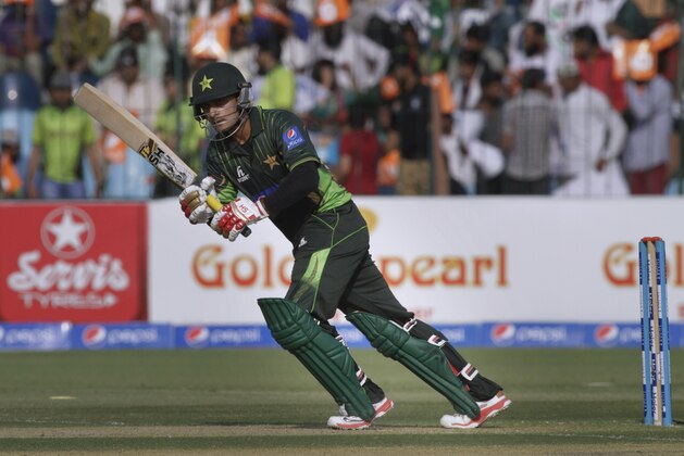Pakistan's Mohammad Hafeez plays a shot during third one-day international match against Zimbabwe at Gaddafi Stadium in Lahore, Pakistan, Sunday, May 31, 2015. (AP Photo/K. M. Chaudary)