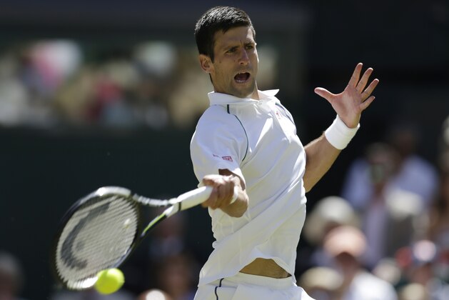 Novak Djokovic of Serbia returns a shot to Richard Gasquet of France during their men's singles semifinal match at the All England Lawn Tennis Championships in Wimbledon, London, Friday July 10, 2015. (AP Photo/Pavel Golovkin)