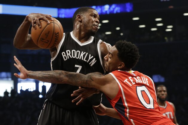 Brooklyn Nets forward Joe Johnson (7) drives to the basket against Atlanta Hawks guard Jeff Teague (0) during the first half in Game 3 of a first-round NBA basketball playoff series, Saturday, April 25, 2015, at  New York.  (AP Photo/Mary Altaffer)