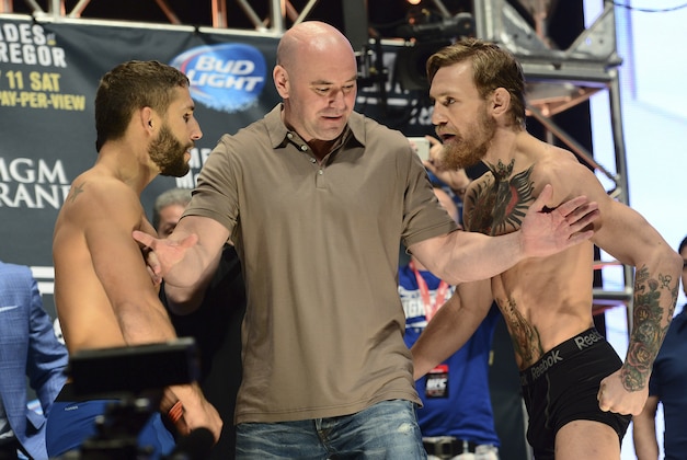 Jul 10, 2015; Las Vegas, NV, USA; UFC president Dana White (center) separates Conor McGregor (right) and Chad Mendes (left) during weigh-ins for UFC 189 at MGM Grand Garden Arena. Mandatory Credit: Joe Camporeale-USA TODAY Sports
