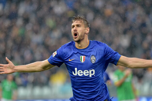 Juventus forward Fernando Llorente celebrates after scoring during a Serie A soccer match between Juventus and Parma at the Juventus stadium, in Turin, Italy, Sunday, Nov. 9, 2014. (AP Photo/Massimo Pinca)