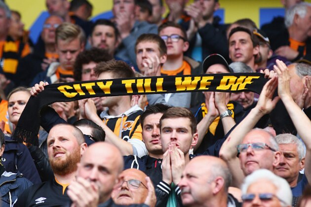 HULL, ENGLAND - MAY 24:  Hull City supporters show their dejection after their team was relegated from the Premier League after the Barclays Premier League match between Hull City and Manchester United at KC Stadium on May 24, 2015 in Hull, England.  (Photo by Matthew Lewis/Getty Images)