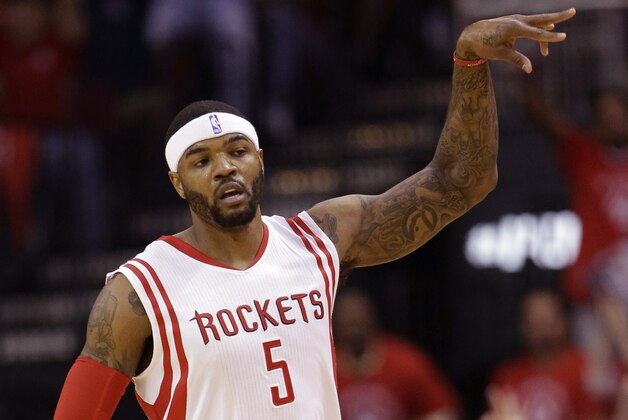 Houston Rockets forward Josh Smith (5) reacts after making a three-point basket against the Golden State Warriors during the first half in Game 4 of the NBA basketball Western Conference finals Monday, May 25, 2015, in Houston. (AP Photo/David J. Phillip)