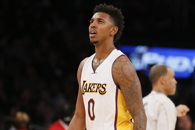 Los Angeles Lakers' Nick Young walks on the court against the New Orleans Pelicans during the second half of an NBA basketball game Sunday, Dec. 7, 2014, in Los Angeles. The Pelicans won 104-87. (AP Photo/Danny Moloshok)