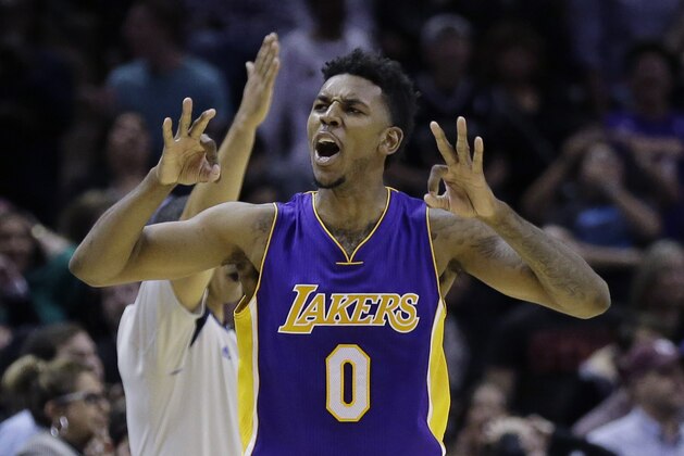 Los Angeles Lakers' Nick Young (0) celebrates after hitting the winning shot against the San Antonio Spurs during overtime of an NBA basketball game, Friday, Dec. 12, 2014, in San Antonio. Los Angeles won 112-110. (AP Photo/Eric Gay) Los Angeles Lakers' Nick Young (0) celebrates after hitting the winning shot against the San Antonio Spurs during overtime of an NBA basketball game, Friday, Dec. 12, 2014, in San Antonio. Los Angeles won 112-110. (AP Photo/Eric Gay)