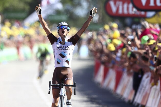 Alexis Vuillermoz of France celebrates as he crosses the finish line of the eighth stage of the Tour de France cycling race over 181.5 kilometers (112.8 miles) with start in Rennes and finish in Mur-de-Bretagne, France, Saturday, July 11, 2015. (AP Photo/Peter Dejong)