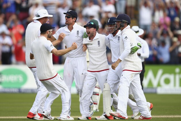 CARDIFF, WALES - JULY 11:  Alastair Cook and Adam Lyth of England and team mates celebrate victory during day four of the 1st Investec Ashes Test match between England and Australia at SWALEC Stadium on July 11, 2015 in Cardiff, United Kingdom.  (Photo by Ryan Pierse/Getty Images)