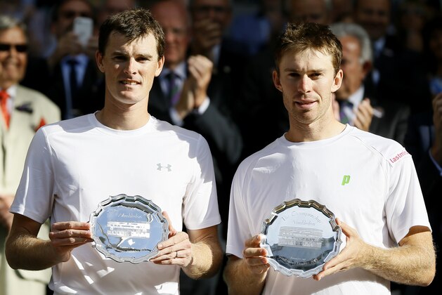 Jamie Murray of Britain, left, and John Peers of Australia hold their runners up trophies after Horia Tecau of Romania and Jean-Julien Rojer of the Netherlands win the men's doubles final at the All England Lawn Tennis Championships in Wimbledon, London, Saturday July 11, 2015. (AP Photo/Kirsty Wigglesworth) Jamie Murray of Britain, left, and John Peers of Australia hold their runners up trophies after Horia Tecau of Romania and Jean-Julien Rojer of the Netherlands win the men's doubles final at the All England Lawn Tennis Championships in Wimbledon, London, Saturday July 11, 2015. (AP Photo/Kirsty Wigglesworth)