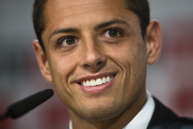 Mexico's international soccer player Javier Hernandez 'Chicharito', listens to a question at a press conference during his official presentation at the Santiago Bernabeu stadium in Madrid, Spain, Monday, Sept. 1, 2014, after signing for Real Madrid. (AP Photo/Andres Kudacki)