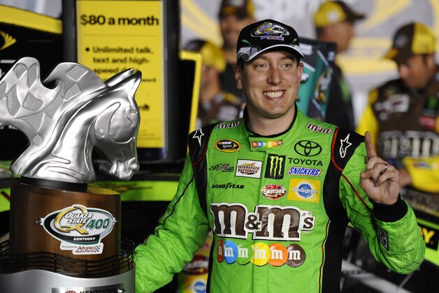 Jul 11, 2015; Sparta, KY, USA; Sprint Cup Series driver Kyle Busch (18) celebrates after winning the Quaker State 400 at Kentucky Speedway. Mandatory Credit: Christopher Hanewinckel-USA TODAY Sports