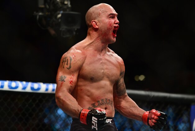 Jul 11, 2015; Las Vegas, NV, USA; Robbie Lawler (red gloves) and Rory MacDonald (not pictured) fight during their welterweight title bout during UFC 189 at MGM Grand Garden Arena. Lawler won via fifth round TKO. Mandatory Credit: Joe Camporeale-USA TODAY Sports