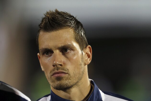 France's Morgan Schneiderlin stands during the playing of his country's national anthem before the start of their international friendly soccer match against Serbia, in Belgrade, Serbia, Sunday, Sept. 7, 2014. (AP Photo/Darko Vojinovic)