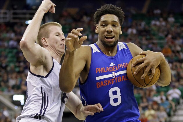 Philadelphia 76ers' Jahlil Okafor (8) drives to the basket as Utah Jazz's Brock Motum, left, defends during the first half of an NBA summer league basketball game Thursday, July 9, 2015, in Salt Lake City. (AP Photo/Rick Bowmer)