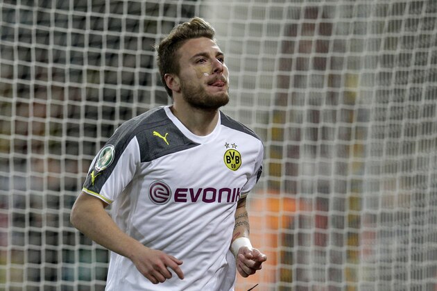 Dortmund's Ciro Immobile from Italy celebrates after scoring the opening goal during the German soccer cup round of sixteen match between third division team Dynamo Dresden and first division team Borussia Dortmund in Dresden, Germany, Tuesday, March 3, 2015. (AP Photo/Michael Sohn)