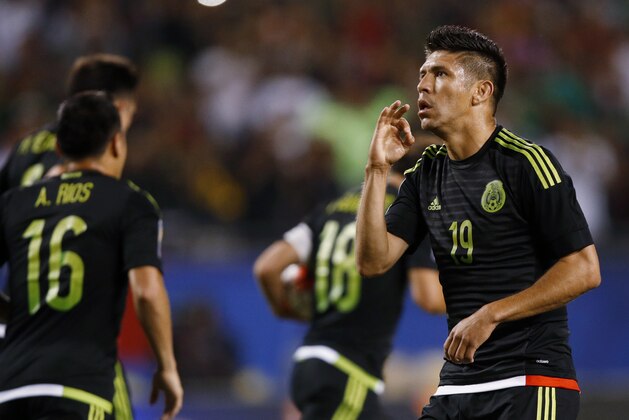 Mexico forward Oribe Peralta (19) celebrates a goal against Cuba during the first half of a CONCACAF Gold Cup soccer match, Thursday, July 9, 2015, in Chicago. Mexico won 6-0. (AP Photo/Andrew A. Nelles)