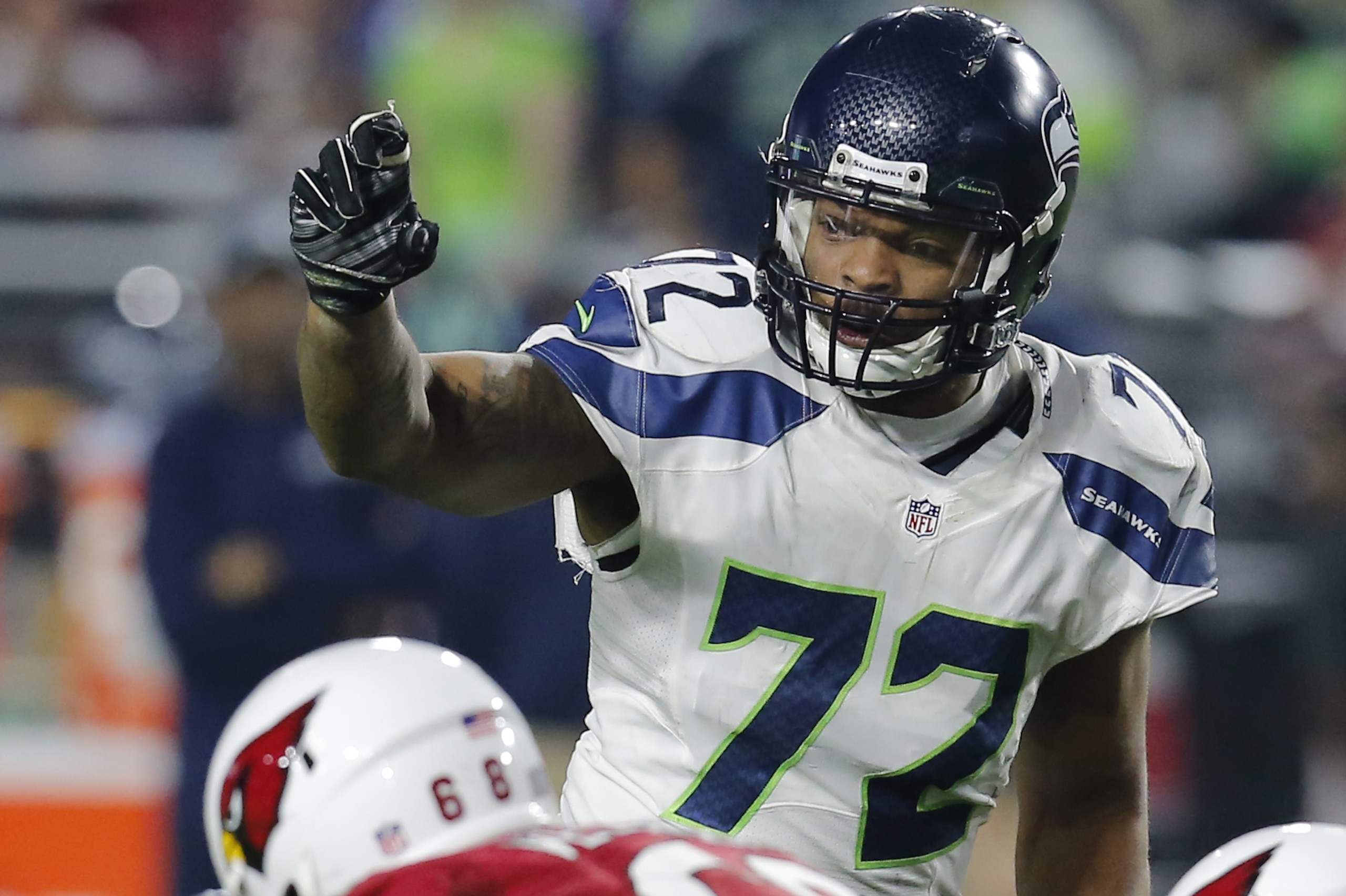 Seattle Seahawks defensive end Michael Bennett (72) during the first quarter of an NFL football game against the Arizona Cardinals, Sunday, Dec. 21, 2014 in Glendale, Ariz. (AP Photo/Rick Scuteri)