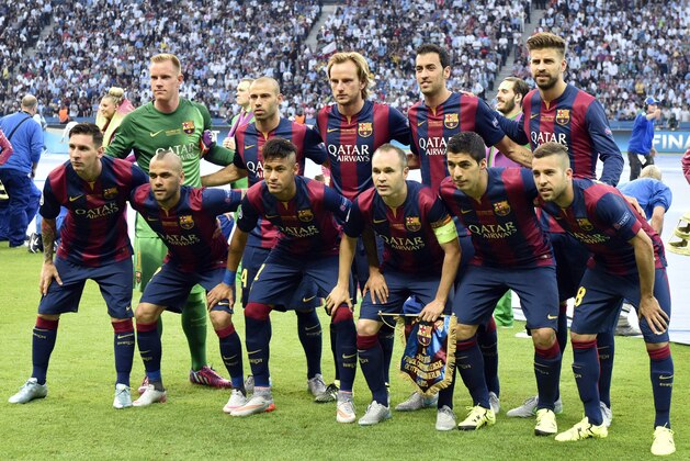 Barcelona's Lionel Messi, Dani Alves, Neymar, Andres Iniesta, Luis Suarez,  Jordi Alba, front row from left, and goalkeeper Marc-Andre ter Stegen, Javier Mascherano,  Ivan Rakitic, Sergio Busquets and Gerard Pique, back row from left, pose for a team group photo prior to the Champions League final soccer match between Juventus Turin and FC Barcelona at the Olympic stadium in Berlin Saturday, June 6, 2015. (AP Photo/Martin Meissner)