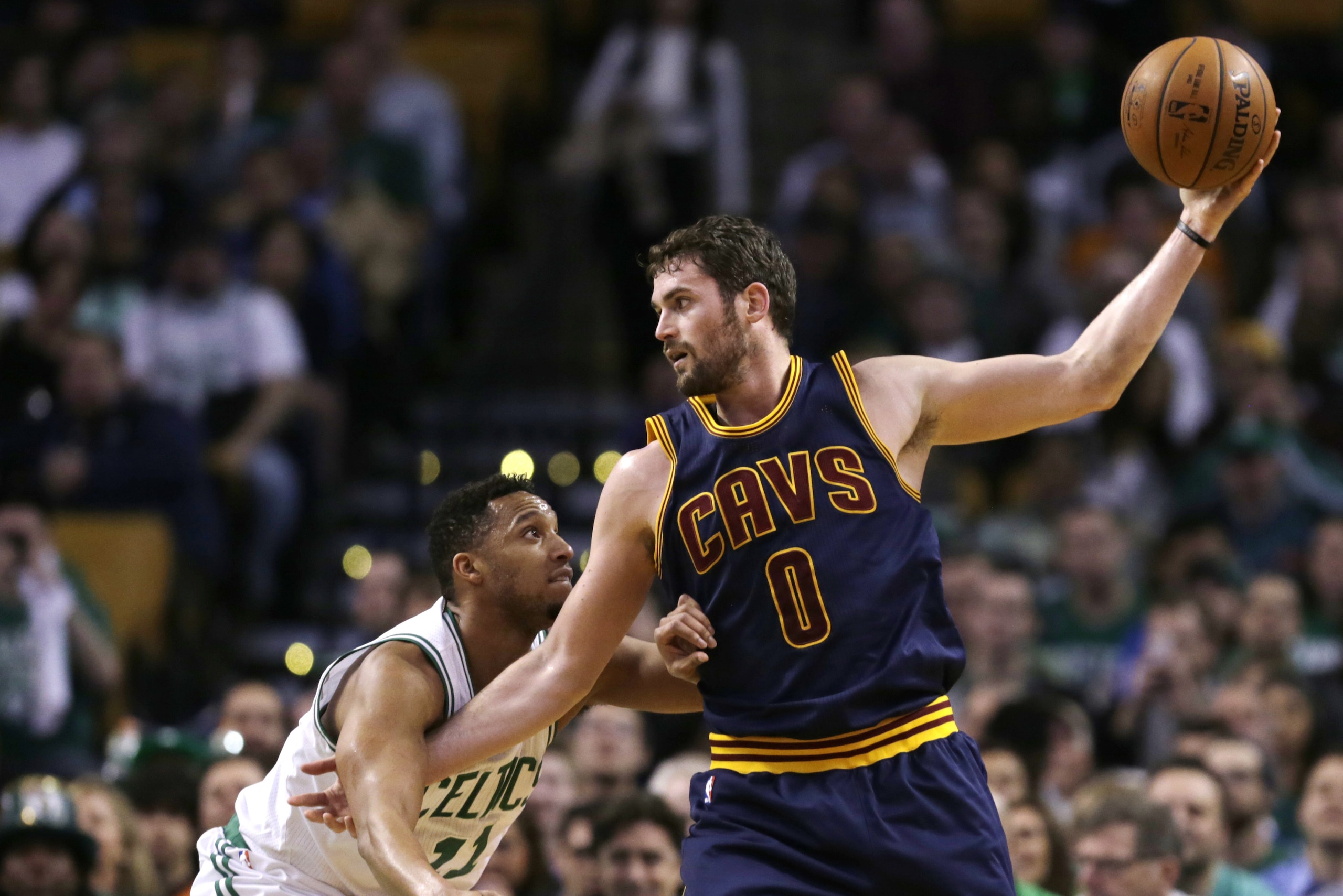 FILE - In this April 23, 2105, file photo, Cleveland Cavaliers forward Kevin Love (0) looks to pass during the first quarter of a first-round NBA playoff basketball game in Boston. Love has watched the Cavaliers reach the finals without him, and with his future uncertain because of free agency, the power forward must soon decide whether to stay in Cleveland or start over elsewhere. (AP Photo/Charles Krupa, File)