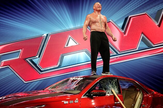 Paul Heyman, left, celebrates with Brock Lesnar after his win over the Undertaker  during Wrestlemania XXX at the Mercedes-Benz Super Dome in New Orleans on Sunday, April 6, 2014. (Jonathan Bachman/AP Images for WWE)