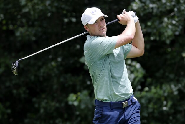 Jordan Spieth watches his tee shot on the second hole during the final round of the John Deere Classic golf tournament Sunday, July 12, 2015, in Silvis, Ill. (AP Photo/Charles Rex Arbogast)
