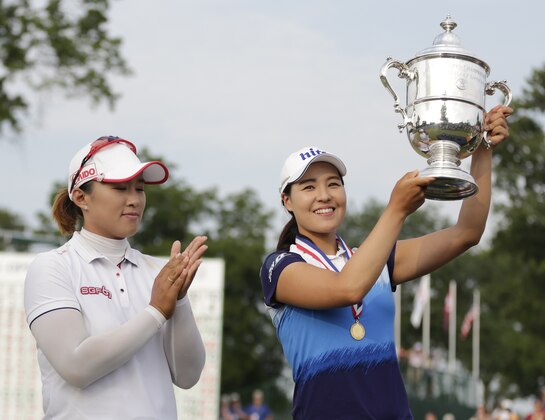 South Korea's In Gee Chun, right, waves after winning the U.S. Women's Open golf tournament by one stroke over Amy Yang, left, at Lancaster Country Club, Sunday, July 12, 2015 in Lancaster, Pa. (AP Photo/Frank Franklin II)