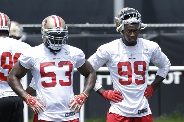 San Francisco 49ers linebackers NaVorro Bowman (53) and Aldon Smith (99) wait to run a drill during practice at an NFL football facility in Santa Clara, Calif., Friday, May 29, 2015. (AP Photo/Jeff Chiu)