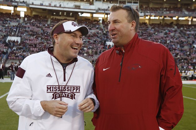 Mississippi State football coach Dan Mullen, left, and Arkansas football coach Bret Bielema confer prior to their teams meeting in an NCAA college football game in Starkville, Miss., Saturday, Nov. 1, 2014. (AP Photo/Rogelio V. Solis) Mississippi State football coach Dan Mullen, left, and Arkansas football coach Bret Bielema confer prior to their teams meeting in an NCAA college football game in Starkville, Miss., Saturday, Nov. 1, 2014. (AP Photo/Rogelio V. Solis)