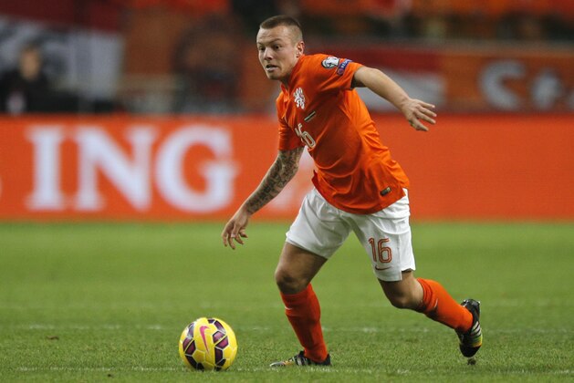 Netherlands' Jordy Clasie passes the ball during the Euro 2016 group A qualifying round soccer match between the Netherlands and Latvia at ArenA stadium in Amsterdam, Netherlands, Sunday, Nov. 16, 2014. (AP Photo/Peter Dejong)