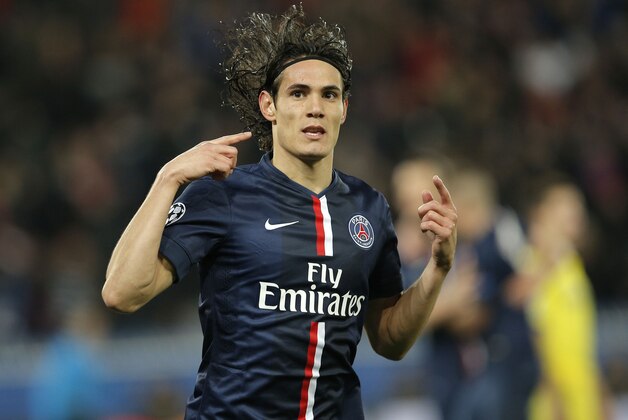 PSG's Edinson Cavani celebrates after scoring his side's first goal during the Champions League round of 16 first leg soccer match between Paris Saint Germain and Chelsea at the Parc des Princes stadium in Paris, France, Tuesday, Feb. 17, 2015. (AP Photo/Christophe Ena)