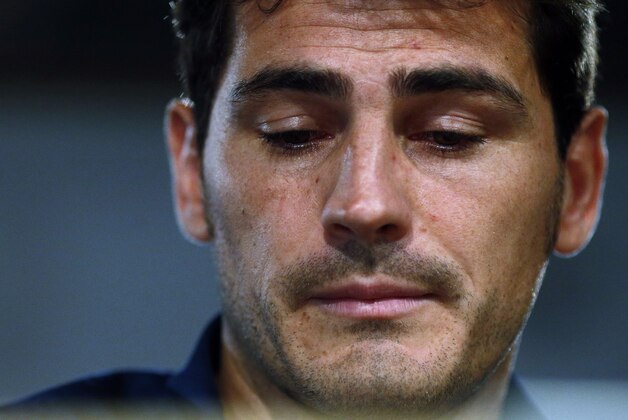 Real Madrid's goalkeeper Iker Casillas pauses during press conference at the Santiago Bernabeu stadium in Madrid, Spain, Sunday, July 12, 2015. Casillas is leaving Real Madrid to join Portuguese club FC Porto after 16 seasons in which he helped the Spanish powerhouse win a slew of titles that included three Champions League crowns and five Spanish league trophies Casillas, 34, joined the club's youth academy at age 9 before debuting for its first team in 1999. (AP Photo/Oscar del Pozo)