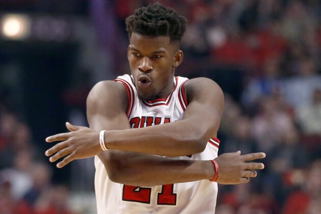 Chicago Bulls guard Jimmy Butler (21) reacts after making a three-point shot during the first half in Game 5 of the NBA basketball playoffs against the Milwaukee Bucks Monday, April 27, 2015, in Chicago. (AP Photo/Charles Rex Arbogast)