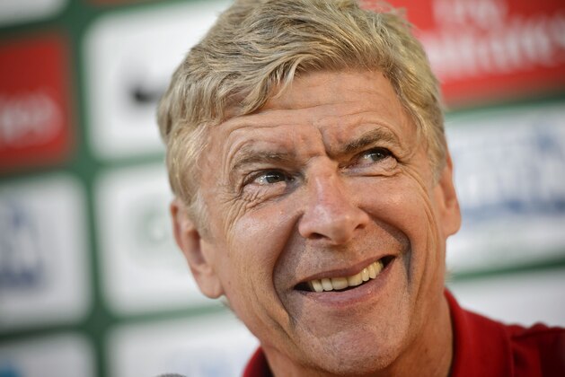 Arsenal manager Arsene Wenger during a press conference, at the Helsinki airport in Vantaa, Finland, Friday, Aug. 9, 2013. Premier League giants Manchester City and Arsenal play their pre-season's last training match at the Helsinki Olympic Stadium on Saturday. (AP Photo?Lehtikuva, Roni Rekomaa)   FINLAND OUT