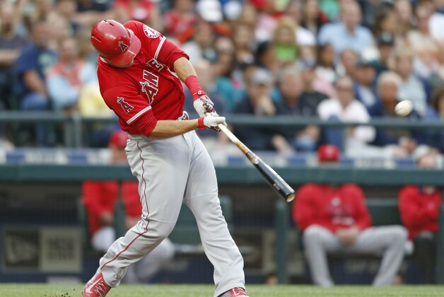 Los Angeles Angles' Mike Trout hits a home run on a pitch from Seattle Mariners' Mike Montgomery during a baseball game on Friday, July 10, 2015, in Seattle. (AP Photo/John Froschauer)