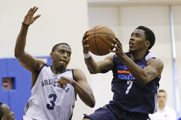 Oklahoma City Thunder's Sema Christon (7) shoots as he gets past Memphis Grizzlies' Andrew Harrison (3) during the second half of an NBA summer league basketball game, Thursday, July 9, 2015, in Orlando, Fla. (AP Photo/John Raoux)