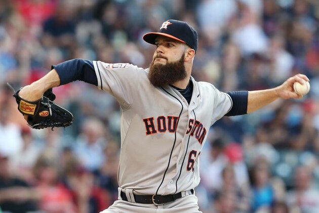 Houston Astros starting pitcher Dallas Keuchel pitches to Cleveland Indians' Yan Gomes during the second inning of a baseball game, Monday, July 6, 2015, in Cleveland. (AP Photo/Ron Schwane)