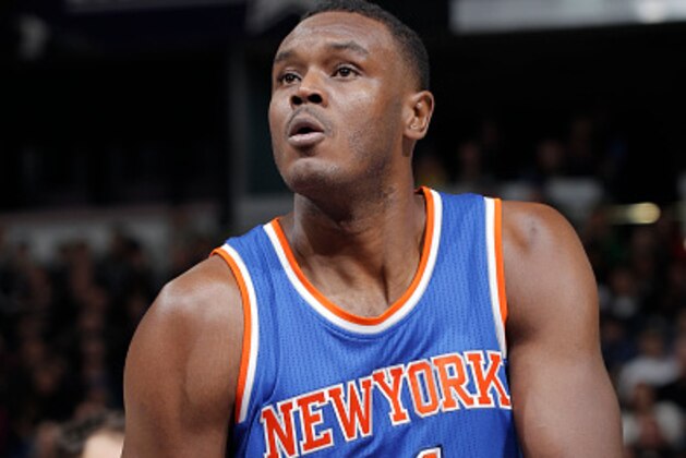 SACRAMENTO, CA - DECEMBER 27: Samuel Dalembert #11 of the New York Knicks attempts a free throw shot against the Sacramento Kings on December 27, 2014 at Sleep Train Arena in Sacramento, California. NOTE TO USER: User expressly acknowledges and agrees that, by downloading and or using this photograph, User is consenting to the terms and conditions of the Getty Images Agreement. Mandatory Copyright Notice: Copyright 2014 NBAE (Photo by Rocky Widner/NBAE via Getty Images)