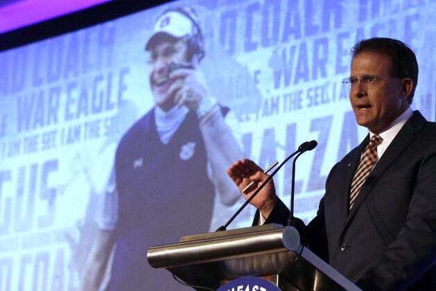 Auburn coach Gus Malzahn speaks to the media during the NCAA college football Southeastern Conference Media Days, Monday, July 13, 2015, in Hoover, Ala. (AP Photo/Butch Dill)