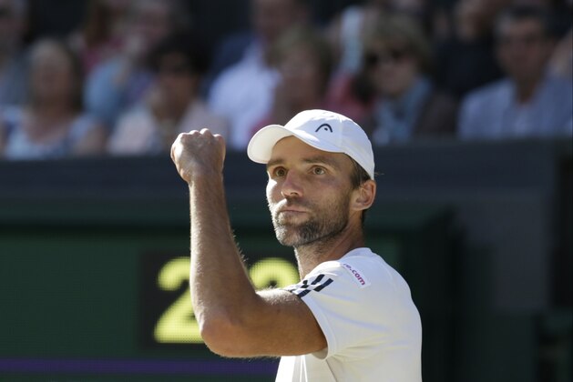 Ivo Karlovic of Croatia gestures during his singles match against Andy Murray of Britain, at the All England Lawn Tennis Championships in Wimbledon, London, Monday July 6, 2015. (AP Photo/Alastair Grant)