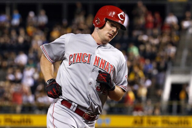 Cincinnati Reds' Jay Bruce rounds third after hitting a solo home run off Pittsburgh Pirates relief pitcher Arquimedes Caminero during the sixth inning of a baseball game in Pittsburgh, Tuesday, June 23, 2015. (AP Photo/Gene J. Puskar)