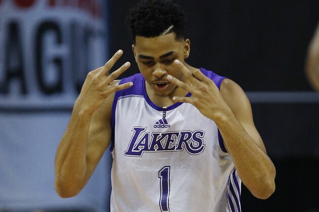 Los Angeles Lakers’ D'Angelo Russell reacts after scoring against the Minnesota Timberwolves during the first half of their NBA summer league basketball game Friday, July 10, 2015, in Las Vegas. (AP Photo/John Locher)