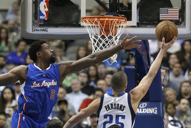 Los Angeles Clippers center DeAndre Jordan (6) defends the basket against Dallas Mavericks forward Chandler Parsons (25) during the first half of an NBA basketball game Monday, Feb. 9, 2015, in Dallas. The Clippers won 115-98. Jordan had 22 points and a career-high 27 rebounds. (AP Photo/LM Otero)