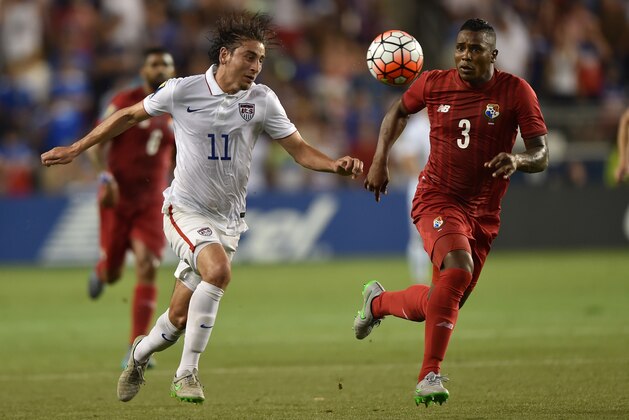 Jul 13, 2015; Kansas City, MO, USA; USA forward Alejandro Bedoya (11) heads the ball in front of Panama defender Harold Cummings (3) in the first half during CONCACAF Gold Cup group play at Sporting Park. Mandatory Credit: Peter G. Aiken-USA TODAY Sports