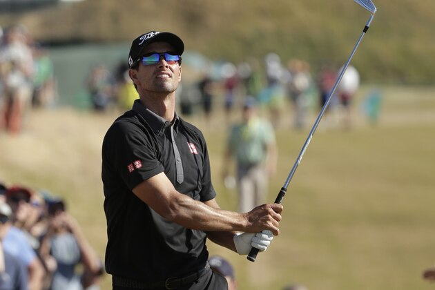 Adam Scott, of Australia, hits from rough on the 11th hole during the second round of the U.S. Open golf tournament at Chambers Bay on Friday, June 19, 2015 in University Place, Wash. (AP Photo/Charlie Riedel)