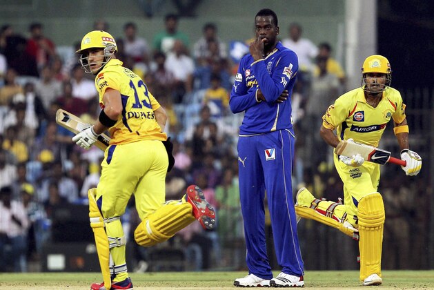Chennai Super Kings' Faf du Plessis, left, and S. Badrinath run between the wickets during the Indian Premier League (IPL) match against  Rajasthan Royals in Chennai, India, Saturday, April 21, 2012. (AP Photo) INDIA OUT