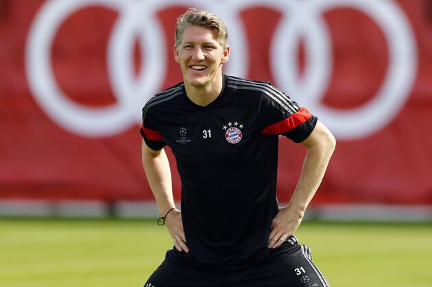 Bayern's Bastian Schweinsteiger stretches during a training session in Munich, southern Germany, Monday, May 11, 2015. FC Bayern Munich will play against FC Barcelona in a second leg semifinal Champions League soccer match on Tuesday. (AP Photo/Matthias Schrader)
