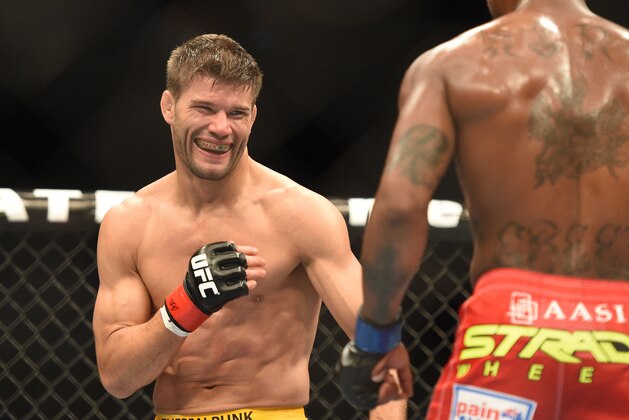 July 26, 2014; San Jose, CA, USA; Josh Thomson (red gloves) fights Bobby Green (blue gloves) during the lightweight bout of the FOX UFC Saturday at SAP Center. Mandatory Credit: Kyle Terada-USA TODAY Sports